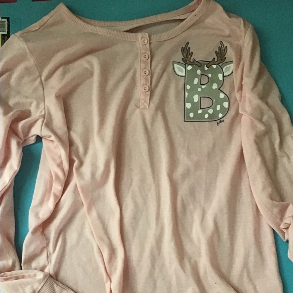 blush pink pajama top with the letter “B”